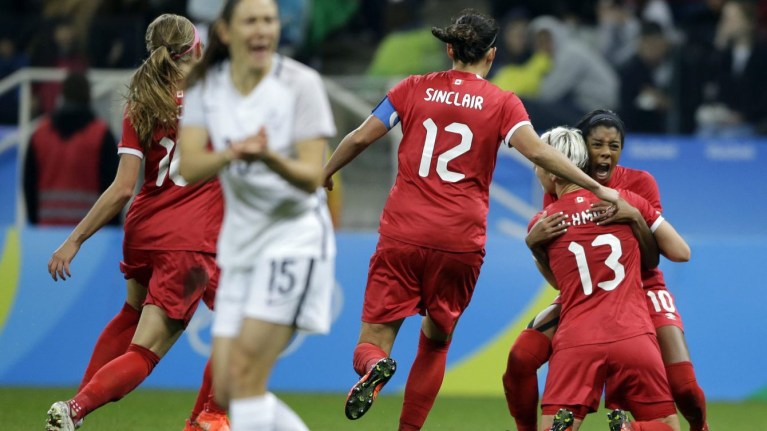 Canada's Sophie Schmidt, 13, celebrates with teammate Canada's Ashley Lawrence celebrates after scoring her team's first goal during a quarter-final match of the women's Olympic football tournament between Canada and France in Sao Paulo, Brazil, Friday Aug. 12, 2016.(AP Photo/Nelson Antoine)