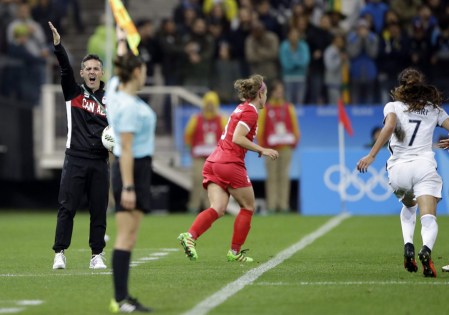 Canada coach John Herdman, left, shouts during a quarter-final match of the women's Olympic football tournament between Canada and France in Sao Paulo, Brazil, Friday Aug. 12, 2016. Canada's won1-0 and went through to the semi-finals.(AP Photo/Nelson Antoine)