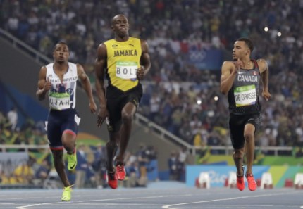 Rio 2016: Andre DeGrasse 100m semifinal Jamaica's Usain Bolt, centre, Canada's Andre De Grasse, right, and Britain's Chijindu Ujah compete in a men's 100-meter semifinal during the athletics competitions of the 2016 Summer Olympics at the Olympic stadium in Rio de Janeiro, Brazil, Sunday, Aug. 14, 2016. (AP Photo/David J. Phillip)