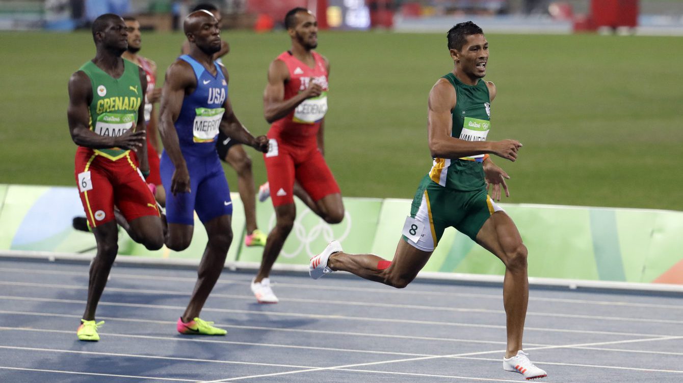 South Africa's Wayde Van Niekerk, right, competes in the men's 400-meter final during the athletics competitions of Rio 2016 at the Olympic stadium in Rio de Janeiro, Brazil, Sunday, Aug. 14, 2016. (AP Photo/Natacha Pisarenko)
