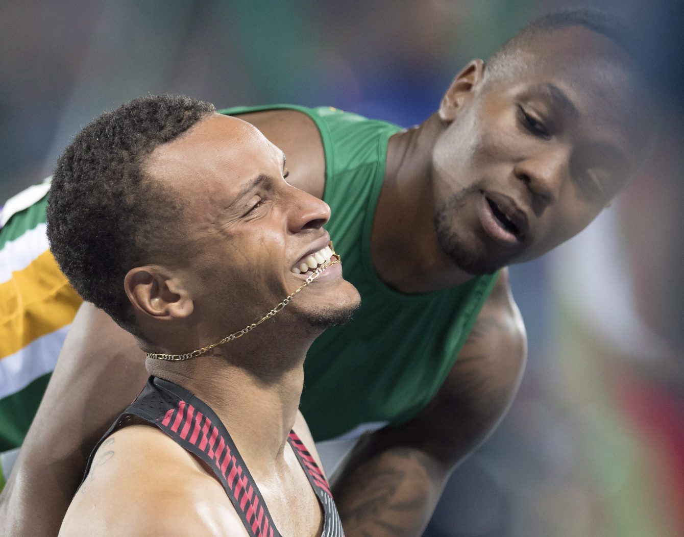 South Africa's Akani Simbine, right, congratulates Canada's Andre De Grasse on winning the bronze medal in the men's 100-metre final during the athletics competition at the 2016 Olympic Summer Games in Rio de Janeiro, Brazil on Sunday, August 14, 2016. THE CANADIAN PRESS/Frank Gunn