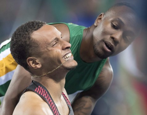 Rio 2016: Andre De Grasse 100m final bronze South Africa's Akani Simbine, right, congratulates Canada's Andre De Grasse on winning the bronze medal in the men's 100-metre final during the athletics competition at the 2016 Olympic Summer Games in Rio de Janeiro, Brazil on Sunday, August 14, 2016. THE CANADIAN PRESS/Frank Gunn