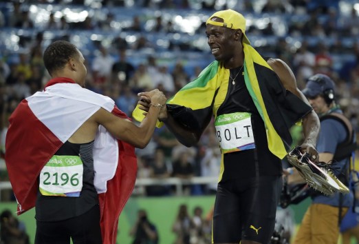 Rio 2016: Andre De Grasse 100m final bronze Jamaica's gold medal winner Usain Bolt is congratulated by Canada's Andre De Grasse after the men's 100-meter final during the athletics competitions of the 2016 Summer Olympics at the Olympic stadium in Rio de Janeiro, Brazil, Sunday, Aug. 14, 2016. (AP Photo/Matt Dunham)