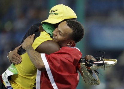 Rio 2016: Andre De Grasse 100m final bronze Jamaica's Usain Bolt embraces Canada's Andre De Grasse after they won gold and bronze respectively in the men's 100-meter final during the athletics competitions of the 2016 Summer Olympics at the Olympic stadium in Rio de Janeiro, Brazil, Sunday, Aug. 14, 2016. (AP Photo/David Goldman)