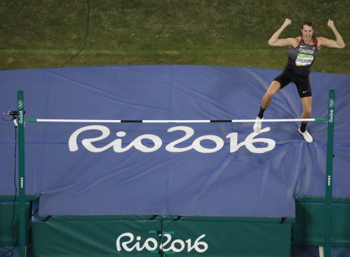 Canada's Derek Drouin competes during the high jump finals during the athletics competitions of the 2016 Summer Olympics at the Olympic stadium in Rio de Janeiro, Brazil, Tuesday, Aug. 16, 2016. (AP Photo/Morry Gash)