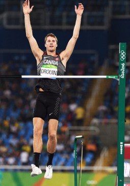 Canada's Derek Drouin celebrates after clearing his fifth jump during the men's high jump final at the 2016 Summer Olympics in Rio de Janeiro, Brazil, Tuesday, August 16, 2016. THE CANADIAN PRESS/Sean Kilpatrick