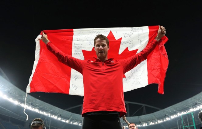 Canada's Derek Drouin celebrates after winning the gold medal in the men's high jump during the athletics competitions of the 2016 Summer Olympics at the Olympic stadium in Rio de Janeiro, Brazil, Tuesday, Aug. 16, 2016. (AP Photo/Lee Jin-man)