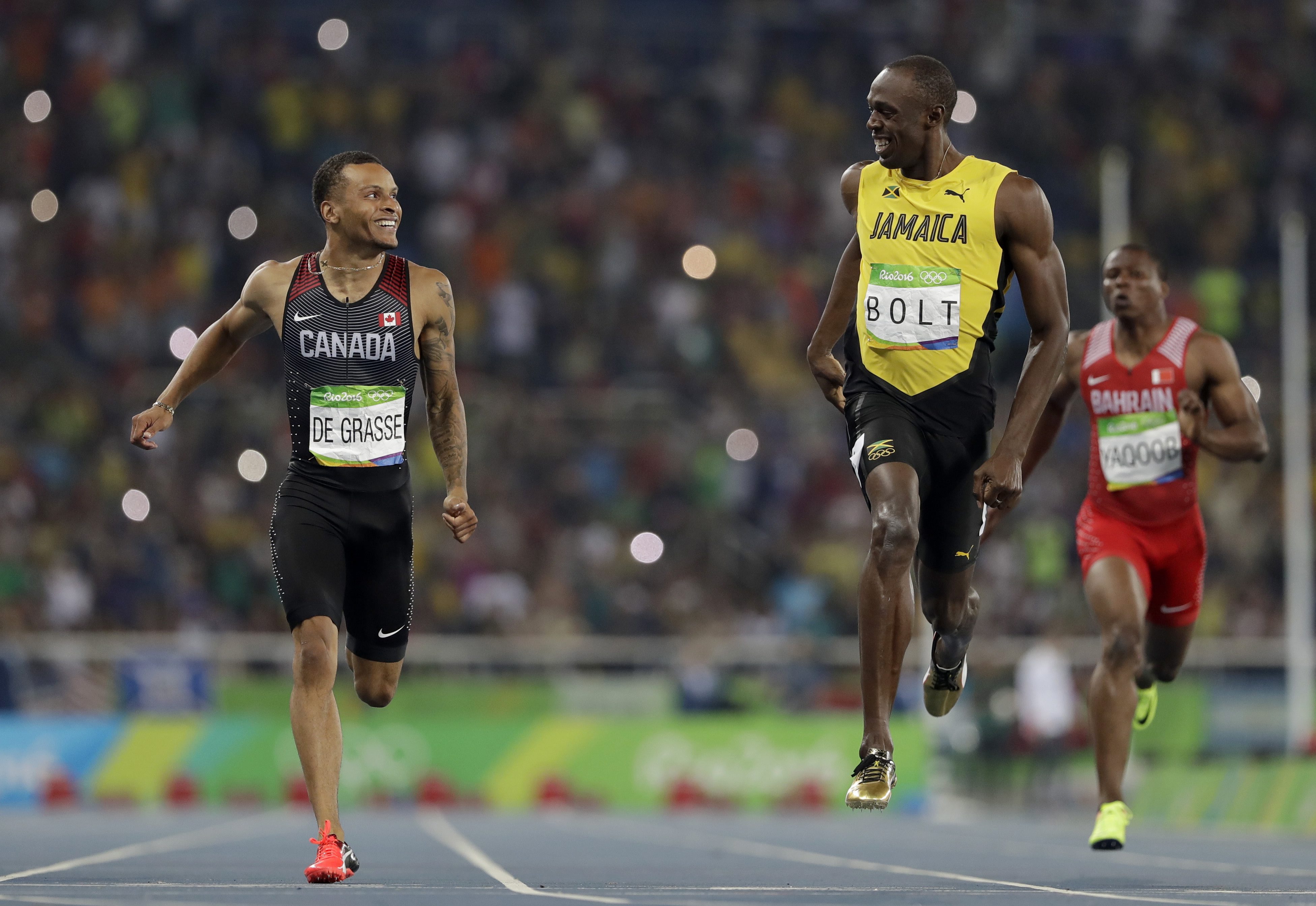 Jamaica's Usain Bolt, right, and Canada's Andre De Grasse compete in a men's 200-meter semifinal during the athletics competitions of the 2016 Summer Olympics at the Olympic stadium in Rio de Janeiro, Brazil, Wednesday, Aug. 17, 2016. (AP Photo/David J. Phillip)