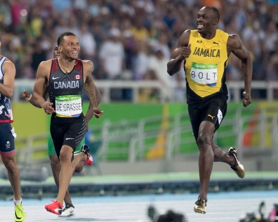 Canada's Andre De Grasse (left) and Jamaica's Usain Bolt share a laugh before they pass the finish line as they set the two fastest times in the 200-metre semifinals at the Olympic games in Rio de Janeiro, Brazil, Wednesday August 17, 2016. THE CANADIAN PRESS/Frank Gunn