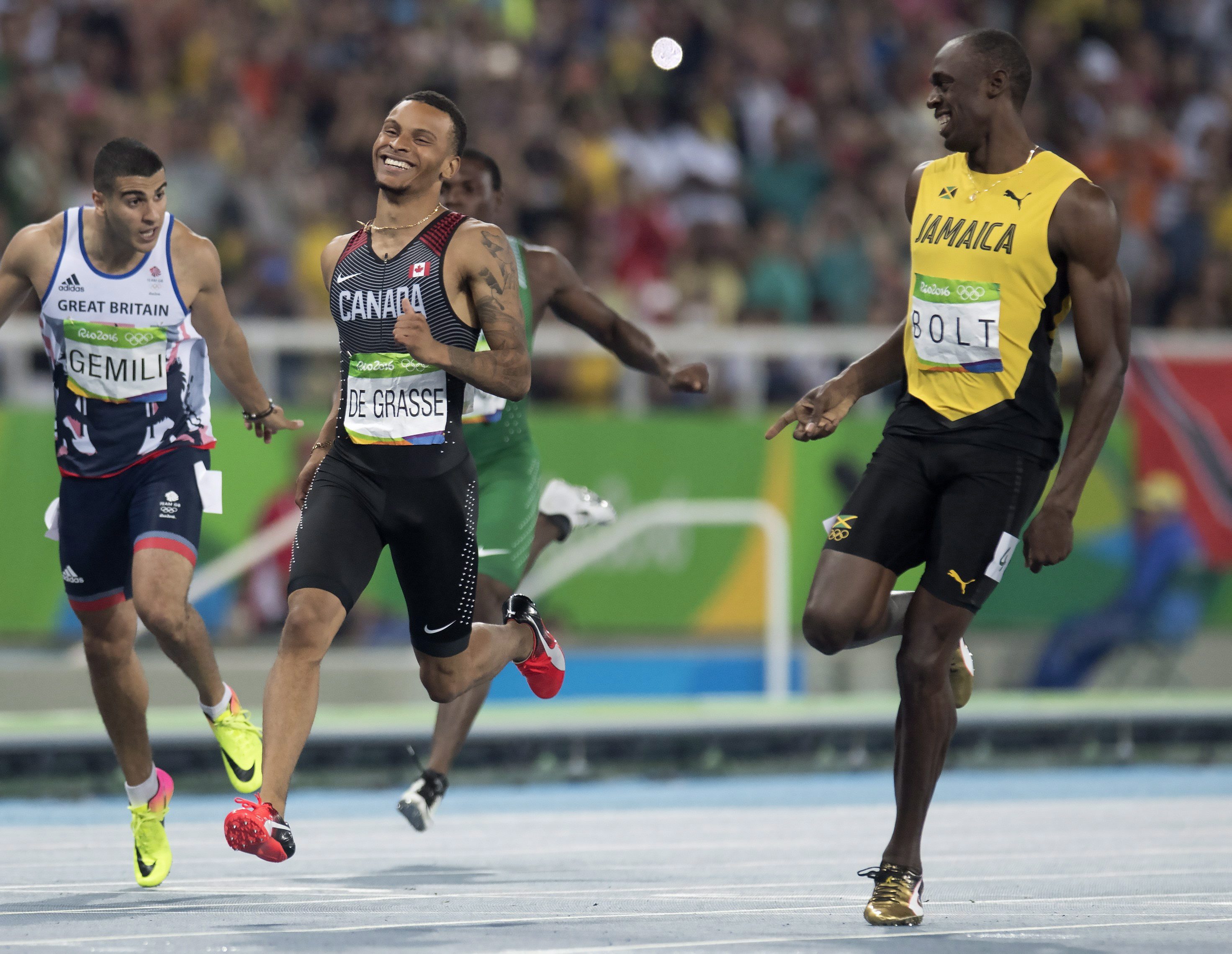 Canada's Andre De Grasse (left) and Jamaica's Usain Bolt share a laugh at the finish line as they set the two fastest times in the 200-metre semifinals at the Olympic games in Rio de Janeiro, Brazil, Wednesday August 17, 2016. THE CANADIAN PRESS/Frank Gunn