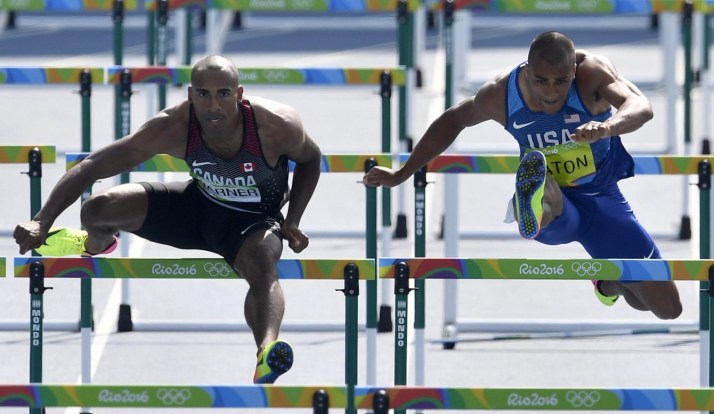 Canada's Damian Warner and United States' Ashton Eaton, right, compete in a men's decathlon 110-meter hurdles heat during the athletics competitions of the 2016 Summer Olympics at the Olympic stadium in Rio de Janeiro, Brazil, Thursday, Aug. 18, 2016. (AP Photo/Martin Meissner)