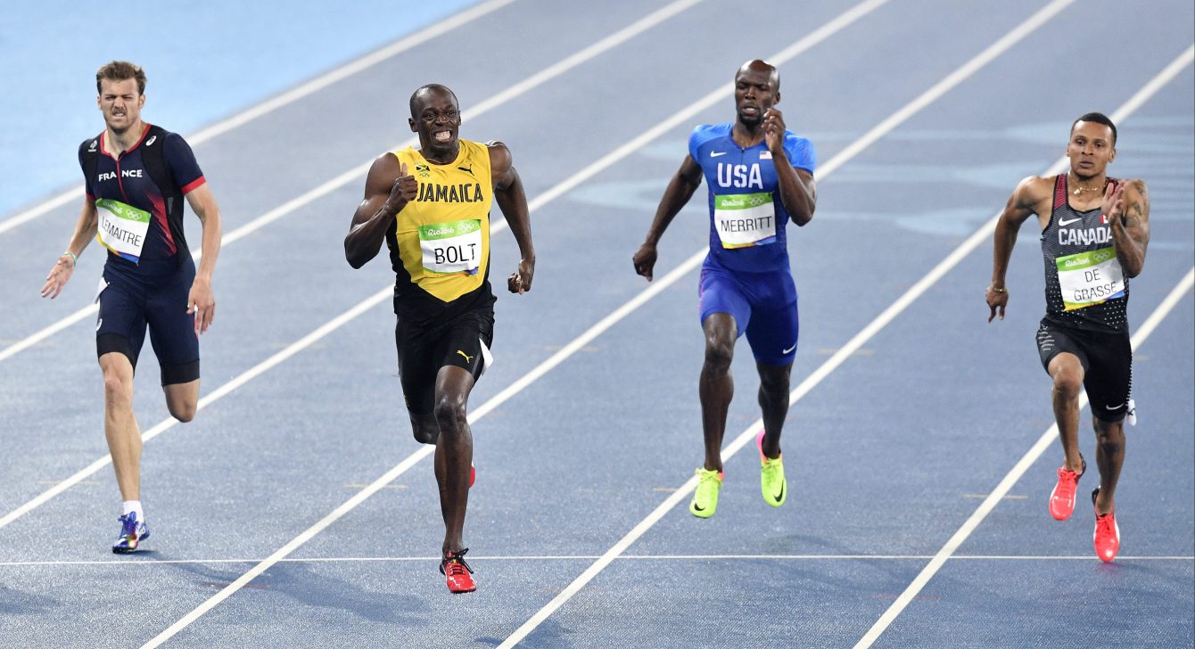 Usain Bolt from Jamaica, second left, wins the gold medal in the men's 200-meter final ahead of second placed Canada's Andre De Grasse, right, and third placed France's Christophe Lemaitre, left, during the athletics competitions of the 2016 Summer Olympics at the Olympic stadium in Rio de Janeiro, Brazil, Thursday, Aug. 18, 2016. (AP Photo/Martin Meissner)
