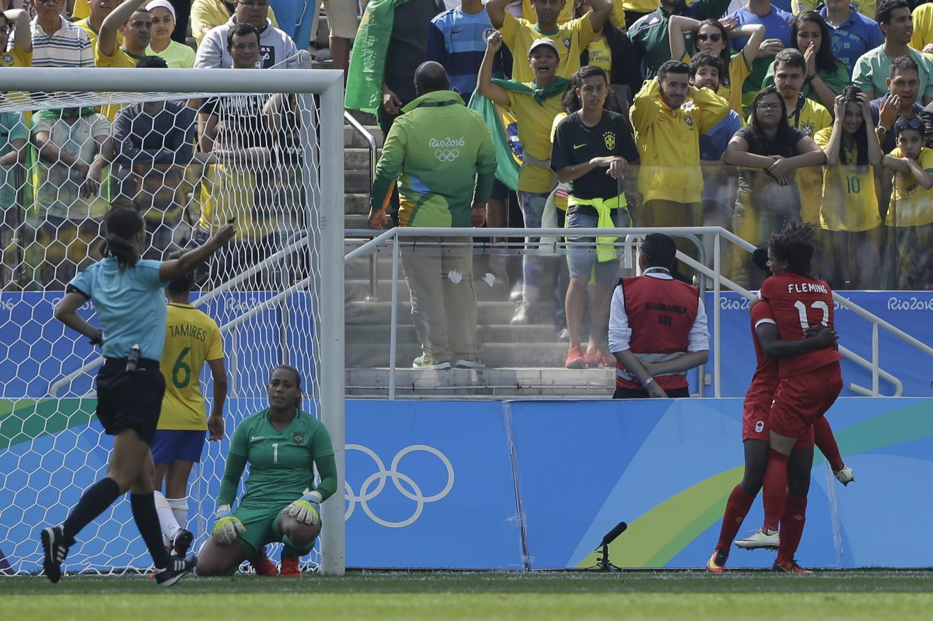 Canada's Deanne Rose, left, is congratulated after scoring her side's first goal by teammate Jessie Fleming during the bronze medal match of the women's Olympic football tournament between Brazil and Canada at the Arena Corinthians stadium in Sao Paulo, Friday Aug. 19, 2016. (AP Photo/Nelson Antoine)