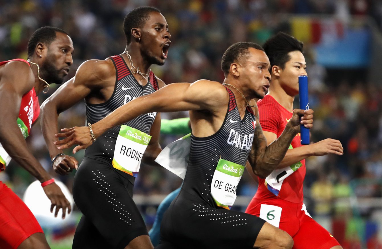 Brendon Rodney hands off baton to Andre De Grasse 