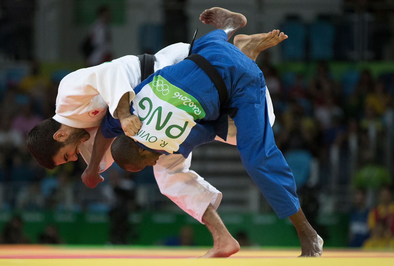 Canada's Antoine Bouchard takes on Raymond Ovinou of Papua New Guinea during Men's 66kg Judo action at the Olympic games in Rio de Janeiro, Brazil, Sunday, August 7, 2016. COC Photo by Jason Ransom