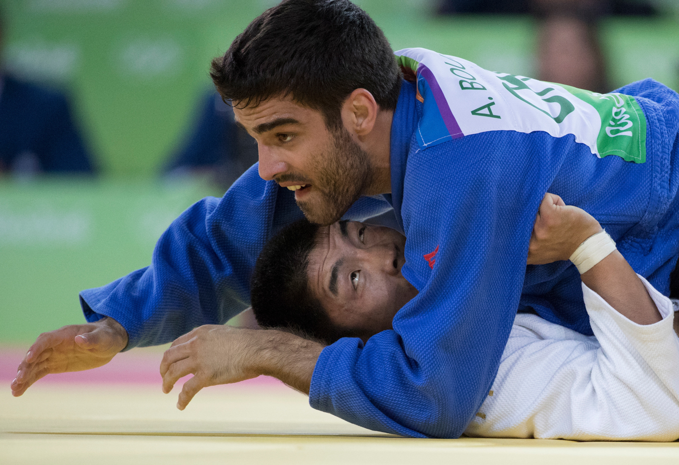Canada's Antoine Bouchard battles with Tumurkhuleg Daaadorj of Mongolia for a spot in the bronze medal match in the Men's 66kg Judo compition at the Olympic games in Rio de Janeiro, Brazil, Sunday, August 7, 2016. Bouchard won the match and will advance. COC Photo by Jason Ransom