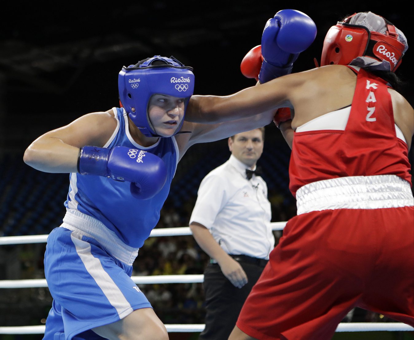 Canada's Ariane Fortin, left, fights Kazakhstan's Dariga Shakimova during a women's middleweight 75-kg preliminary boxing match at the 2016 Summer Olympics in Rio de Janeiro, Brazil, Sunday, Aug. 14, 2016. (AP Photo/Frank Franklin II)