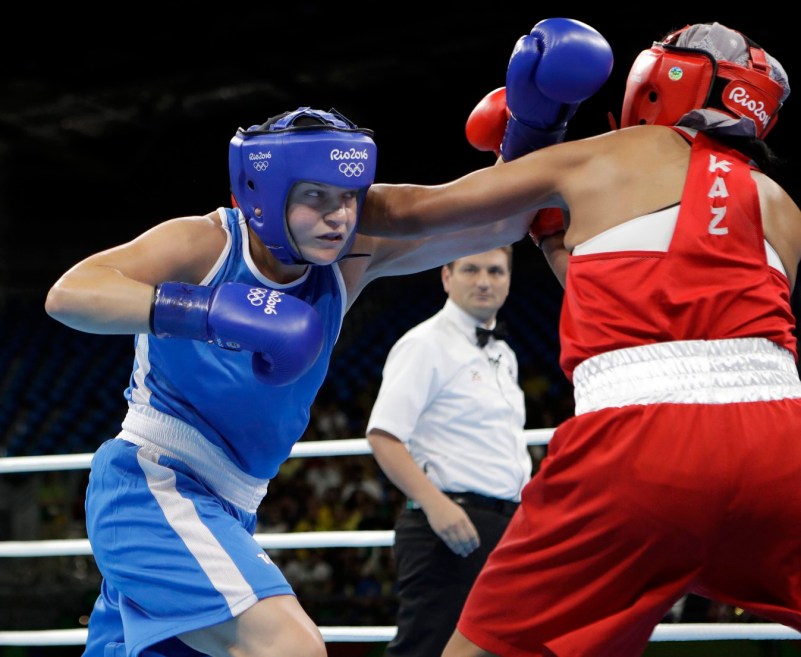 Canada's Ariane Fortin, left, fights Kazakhstan's Dariga Shakimova during a women's middleweight 75-kg preliminary boxing match at the 2016 Summer Olympics in Rio de Janeiro, Brazil, Sunday, Aug. 14, 2016. (AP Photo/Frank Franklin II)