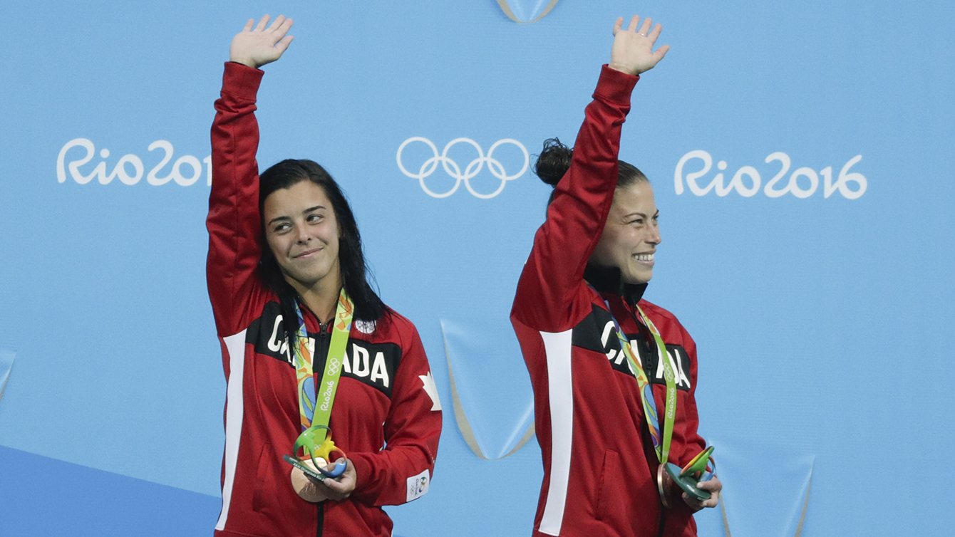 Meaghan Benfeito and Roseline Filion accept their bronze medal for 10m platform diving on August 9, 2016 at Rio 2016. 