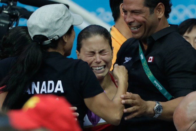 Canada's Roseline Filion reacts to the results which gave her and partner Meaghan Fillion the bronze medal in the women's synchronized 10-meter platform diving final at the 2016 Summer Olympics in Rio de Janeiro, Brazil, Tuesday, Aug. 9, 2016 (photo/Jason Ransom)