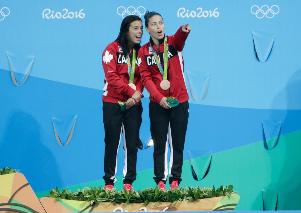 Benfeito and Filion pose with their medals after winning a bronze in the 10m platform synchro dive. (photo/Jason Ransom)