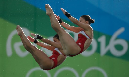 Canada's Meaghan Benfeito (left) and Roseline Filion perform in the women's synchronized 10-meter platform diving final at the 2016 Summer Olympics in Rio de Janeiro, Brazil, Tuesday, Aug. 9, 2016 (photo/ Jason Ransom)