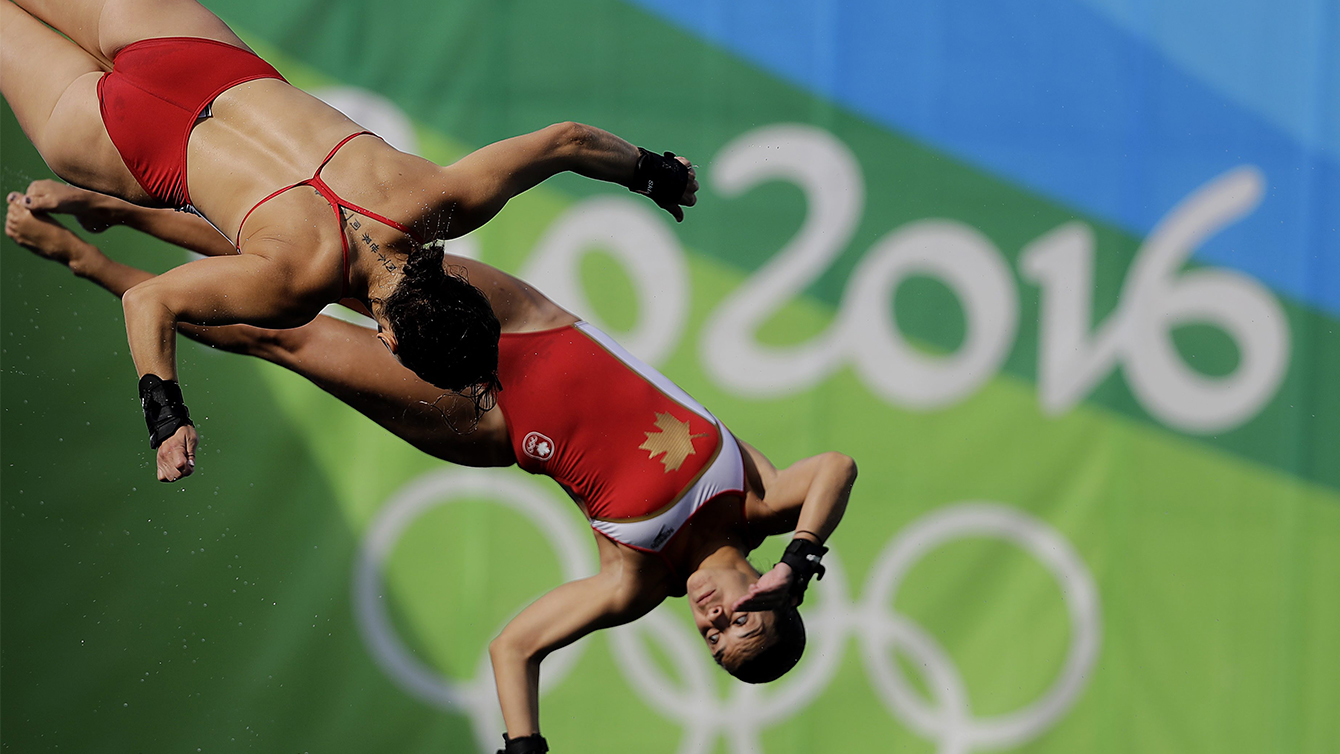 Meaghan Benfeito and Roseline Filion at the women's synchronized 10-meter platform diving final in the Maria Lenk Aquatic Center at the 2016 Summer Olympics in Rio de Janeiro, Brazil, Tuesday, Aug. 9, 2016. (AP Photo/Wong Maye-E)