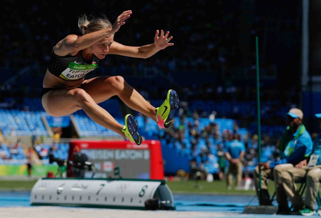 Brianne Theisen-Easton flies in the air during a long jump 