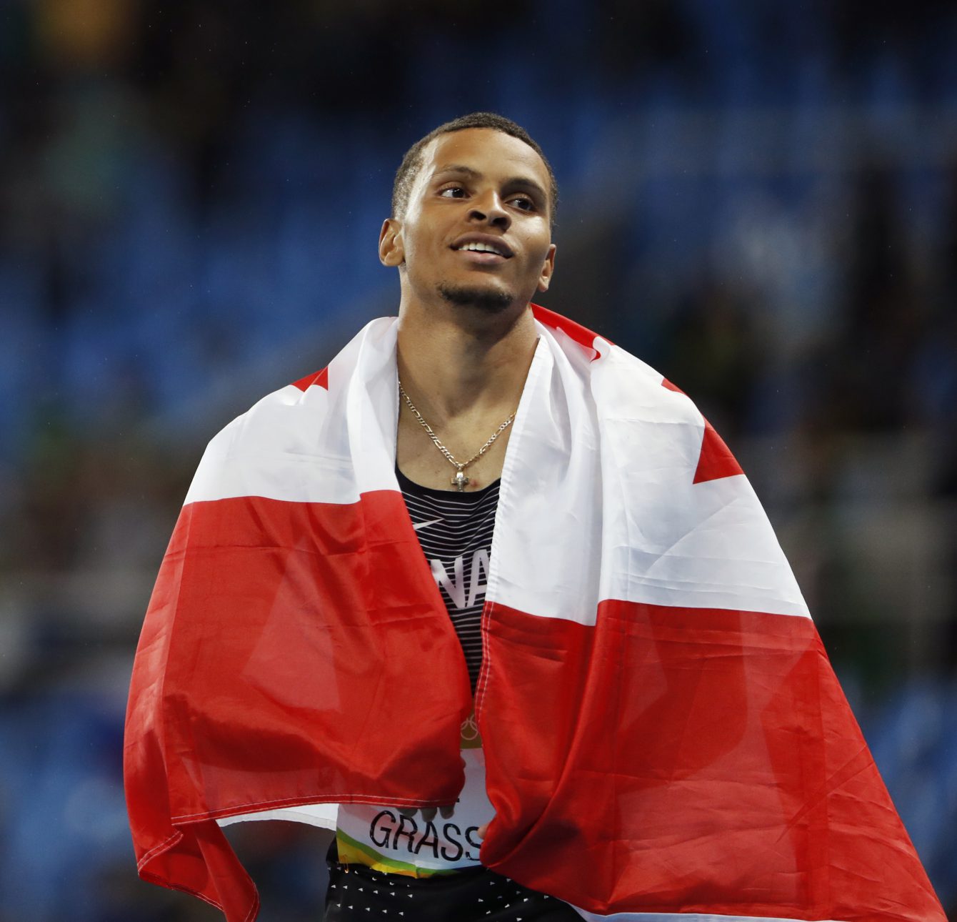Canada's Andre De Grasse celebrates silver in the men's 200m final at the 2016 Olympic Summer Games in Rio de Janeiro, Brazil on Thursday, Aug. 18, 2016. (photo/ Stephen Hosier)