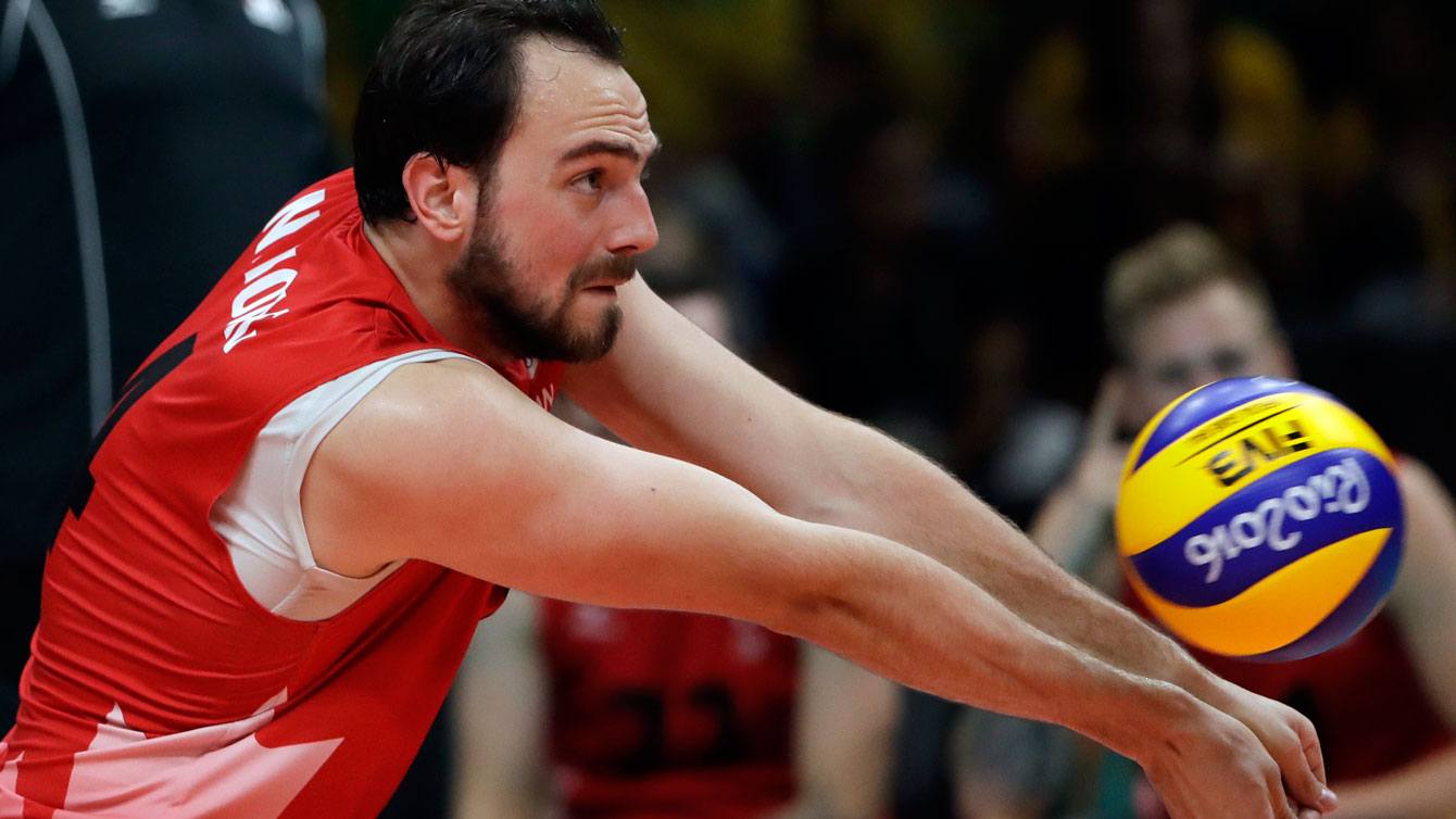 Nicholas Hoag bumps against Italy during Canada's Olympic group stage match on August 15, 2016.