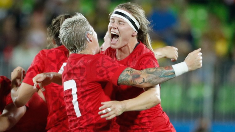 Rio 2016: Karen Paquin Karen Paquin hugs captain Jen Kish after winning bronze for rugby on August 8, 2016.