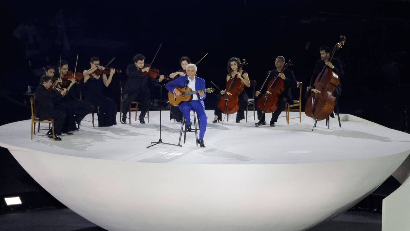 Paulinho da Viola sings Brazil's national anthem at Rio 2016 Opening Ceremony, Friday, Aug. 5, 2016. (AP Photo/Charlie Riedel)