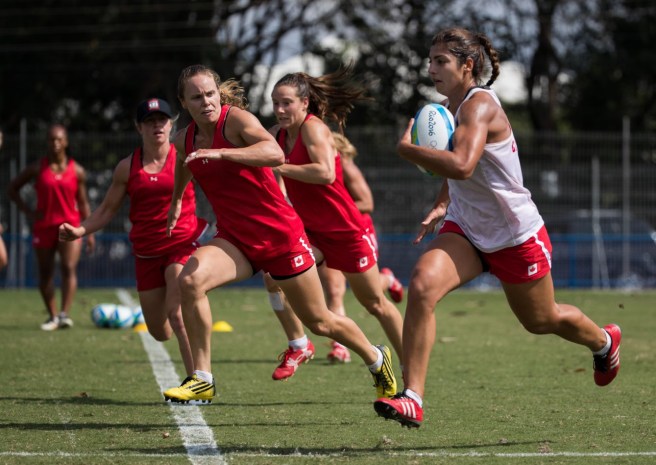 Team Canada's Bianca Farella, right, runs wit the ball past Karen Paquin, left, during women's rugby practice ahead of the Olympic games in Rio de Janeiro, Brazil, Tuesday August 2, 2016. COC Photo/Mark Blinch
