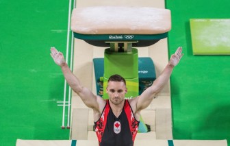 Canada's Scott Morgan performs on the vault during men's artistic gymnastics qualifying at the Olympic games in Rio de Janeiro, Brazil, Saturday August 6, 2016. COC Photo/Mark Blinch