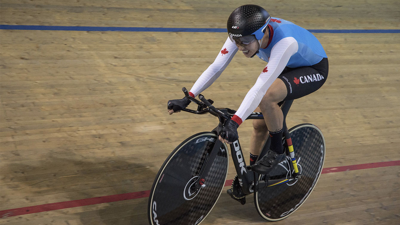 Simmerling racing on bike in velodrome