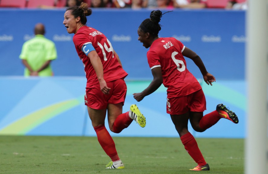 Canada's Melissa Tancredi and Deanne Rose celebrate after scoring during a Group F match of the women's Olympic football tournament between Germany and Canada at the National Stadium, in Brasilia, Brazil, Tuesday, Aug. 9, 2016. (AP Photo/Eraldo Peres)