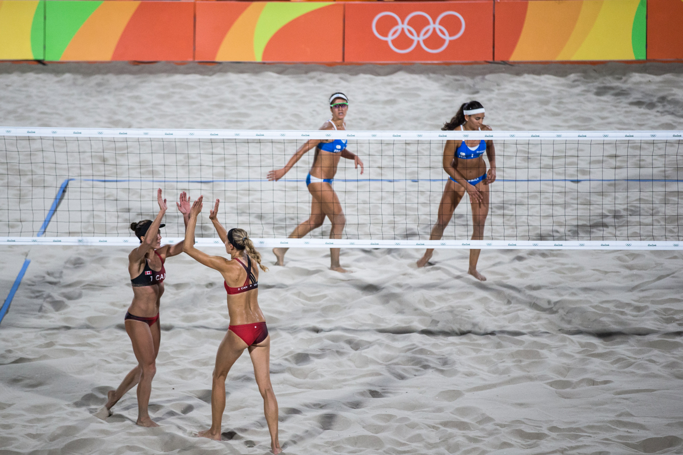 Team Canada's women's beach volleyball duo, Kristina Valjas and Jamie Broder, battle in a preliminary match against Italy, Copacabana Beach, Rio de Janeiro, Brazil, Sunday August 7, 2016. COC Photo/David Jackson