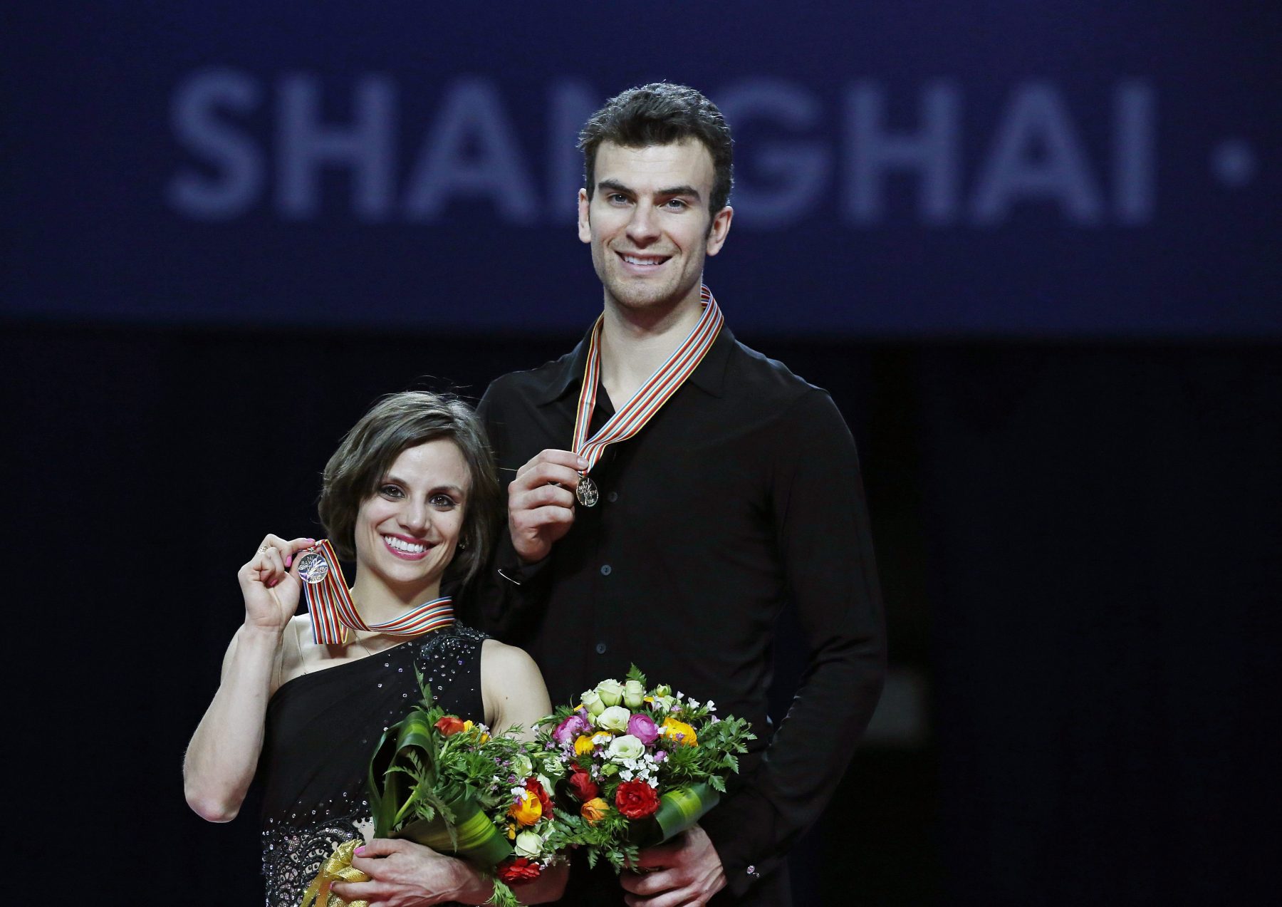 Meagan Duhamel and Eric Radford with their gold medals from the 2015 World Championships