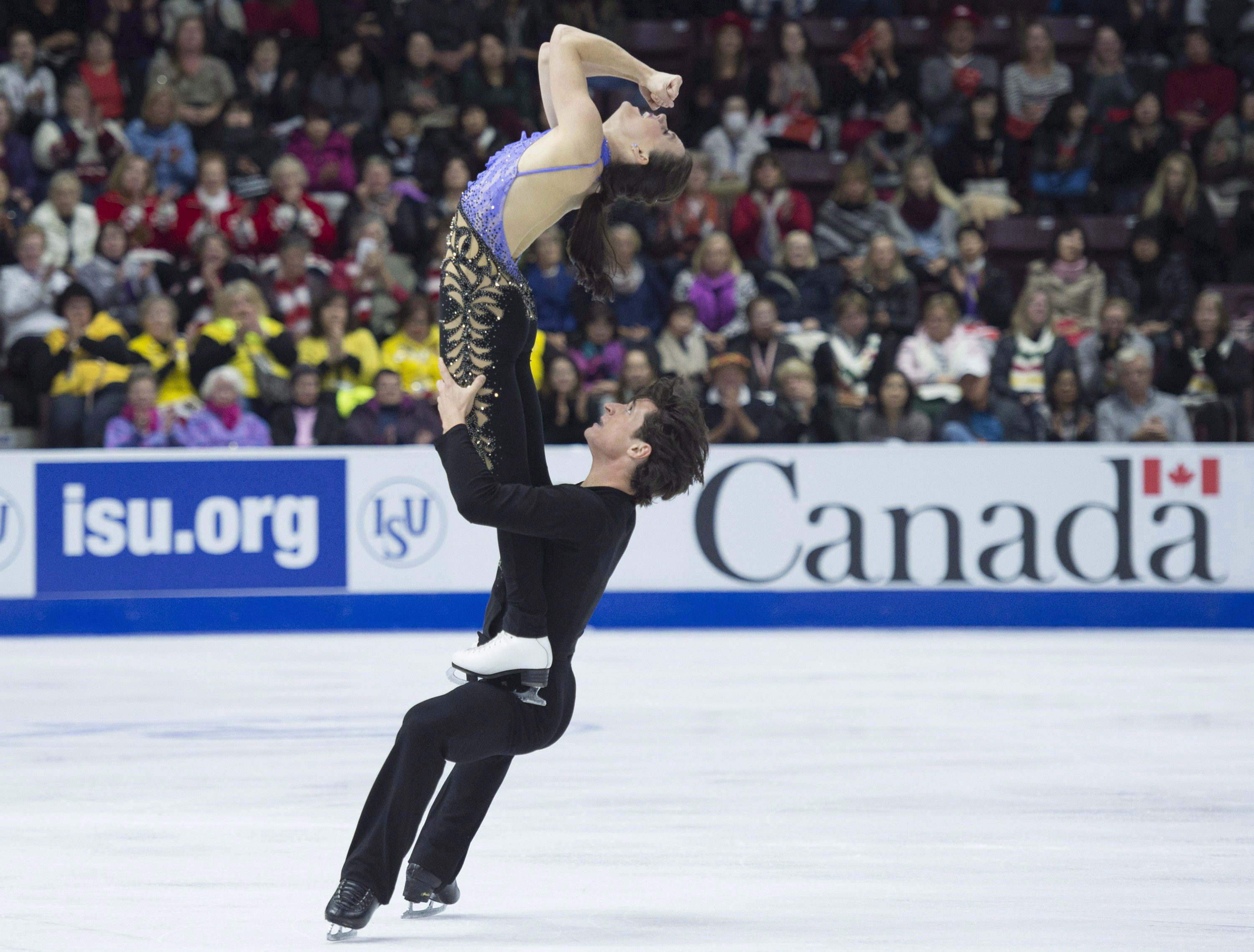 Tessa Virtue and Scott Moir of Canada perform in the ice dance short program during the 2016 Skate Canada International competition in Mississauga, Ont., on Friday, October 28, 2016. THE CANADIAN PRESS/Nathan Denette