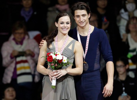 Canada's Tessa Virtue and Scott Moir stand on the podium with their gold medals during the 2016 Skate Canada International competition in Mississauga, Ont., on Saturday, October 29, 2016. THE CANADIAN PRESS/Mark Blinch