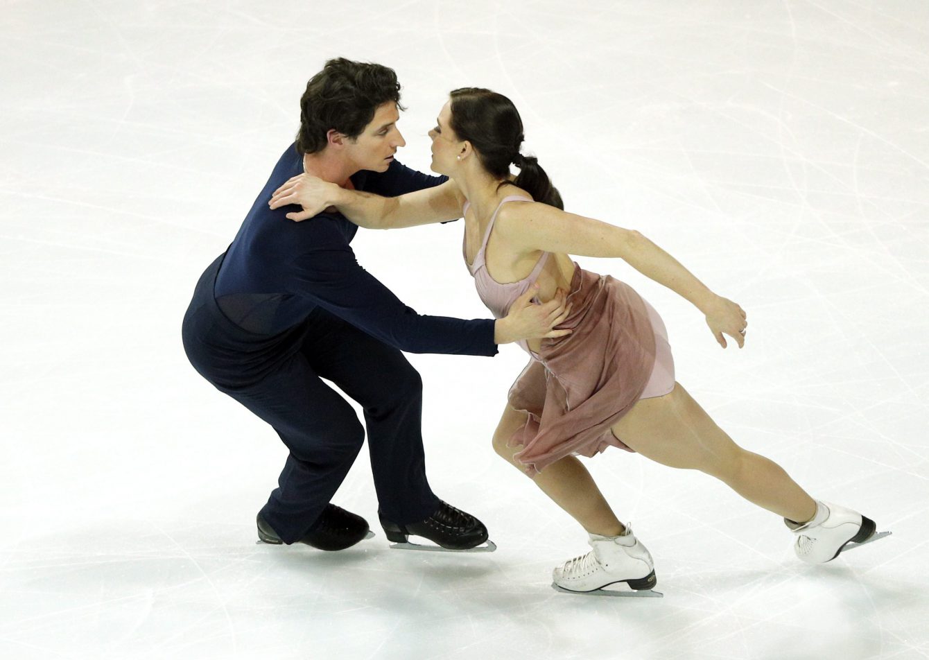 Tessa Virtue and Scott Moir of Canada compete in the Ice Dance Free Dance Program during ISU Grand Prix of Figure Skating Final in Marseille, southern France, Saturday, Dec. 10, 2016. (AP Photo/Christophe Ena)