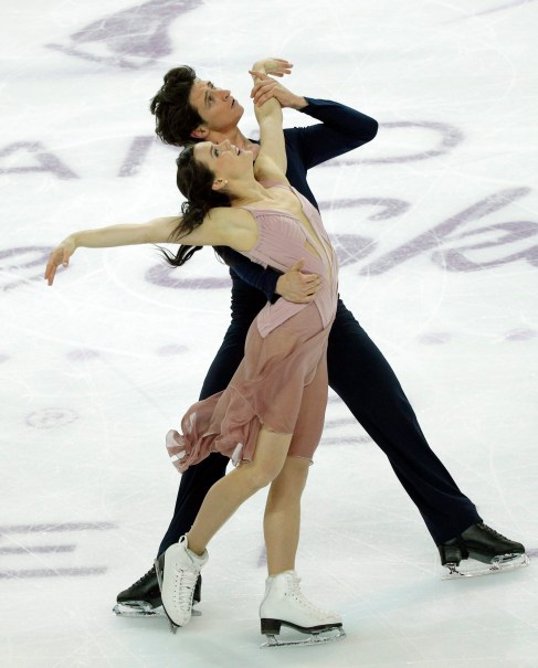 Tessa Virtue and Scott Moir of Canada compete in the Ice Dance Free Dance Program during ISU Grand Prix of Figure Skating Final in Marseille, southern France, Saturday, Dec. 10, 2016. (AP Photo/Christophe Ena)