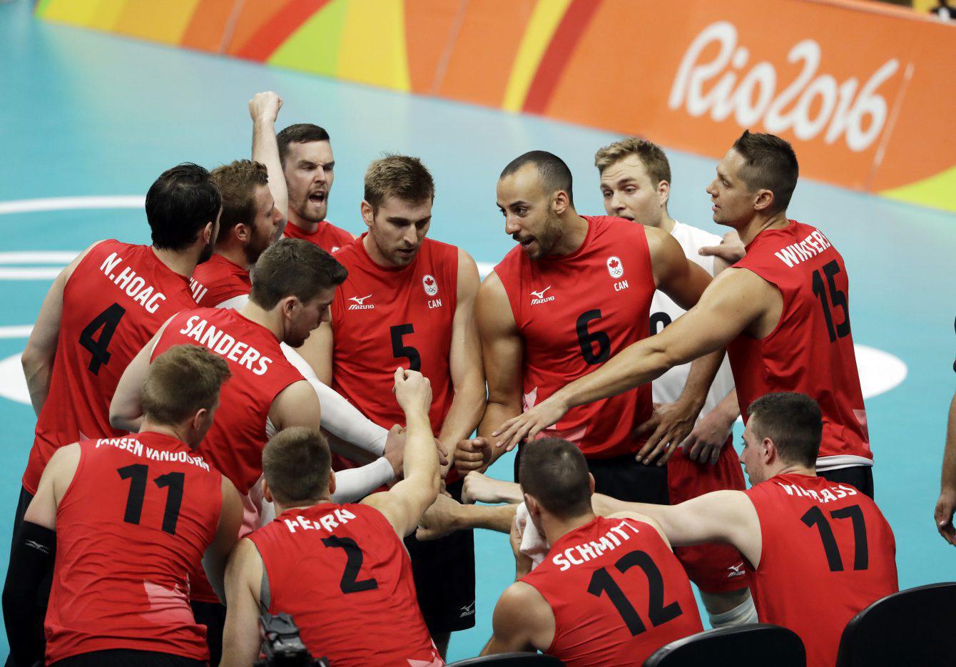 Canada's volleyball team celebrates round robin win against Mexico at Rio 2016 on Saturday, August 13, 2016. (AP Photo/Matt Rourke)