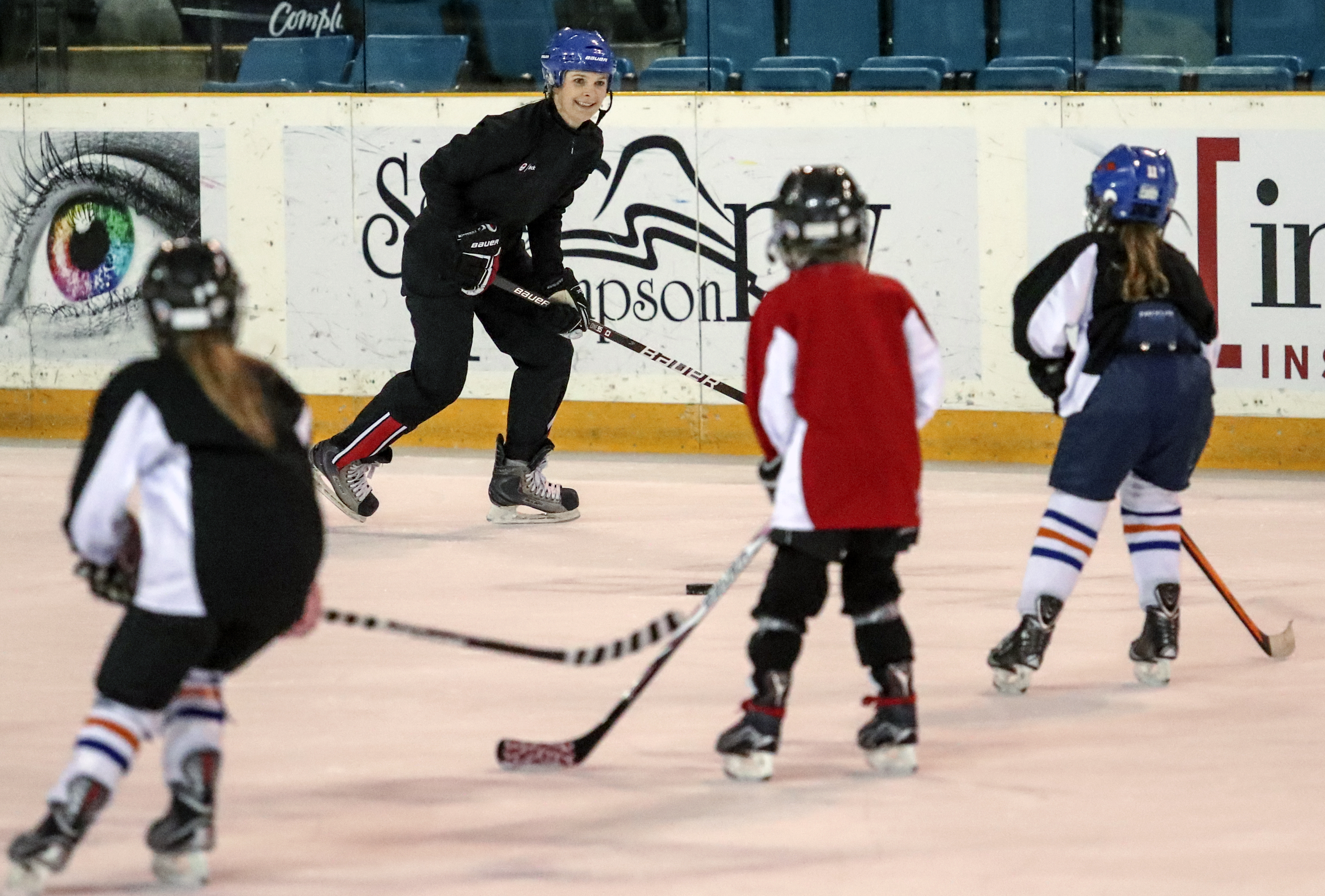 Jennifer Botterill coaches nine-year-old participants at the Teck Coaching Series in Kamloops, BC on December 3, 2016. (photo: Allen Douglas)