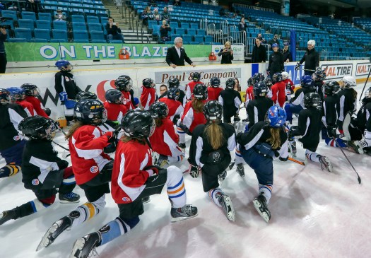 Tom Renney, Jennifer Botterill and Marty Turco speak to the young players participating in the Teck Coaching Series in Kamloops, BC on December 3, 2016 (photo: Allen Douglas)