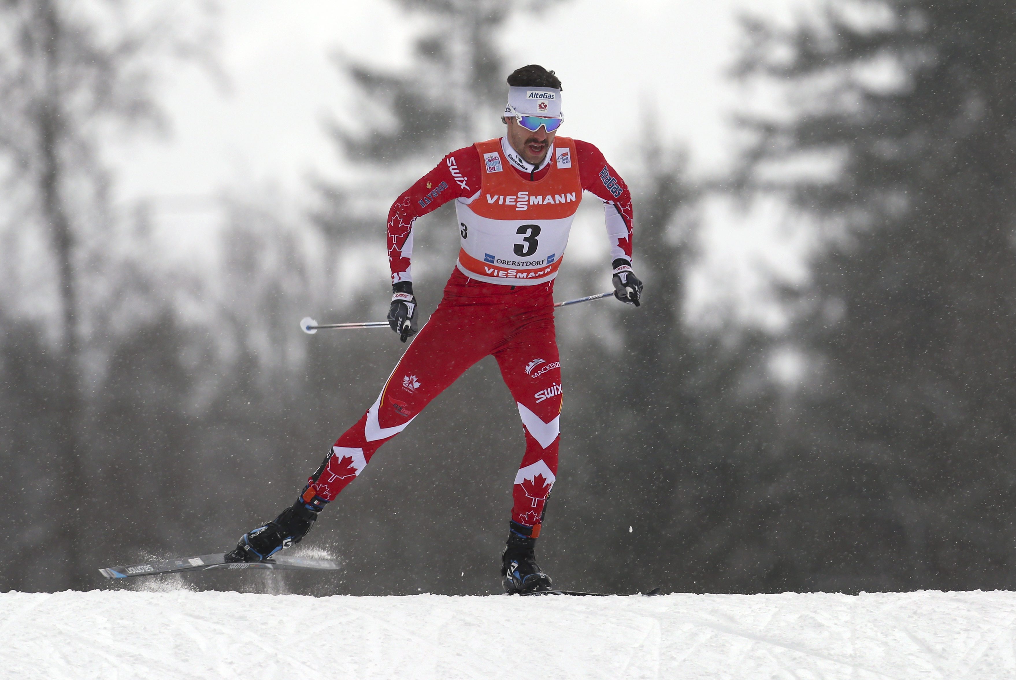 Alex Harvey of Canada skis during the men's pursuit race at the FIS Tour de Ski in Oberstdorf, Germany, Wednesday, Jan. 4, 2017. ( Karl-Josef Hildenbrand/dpa via AP)