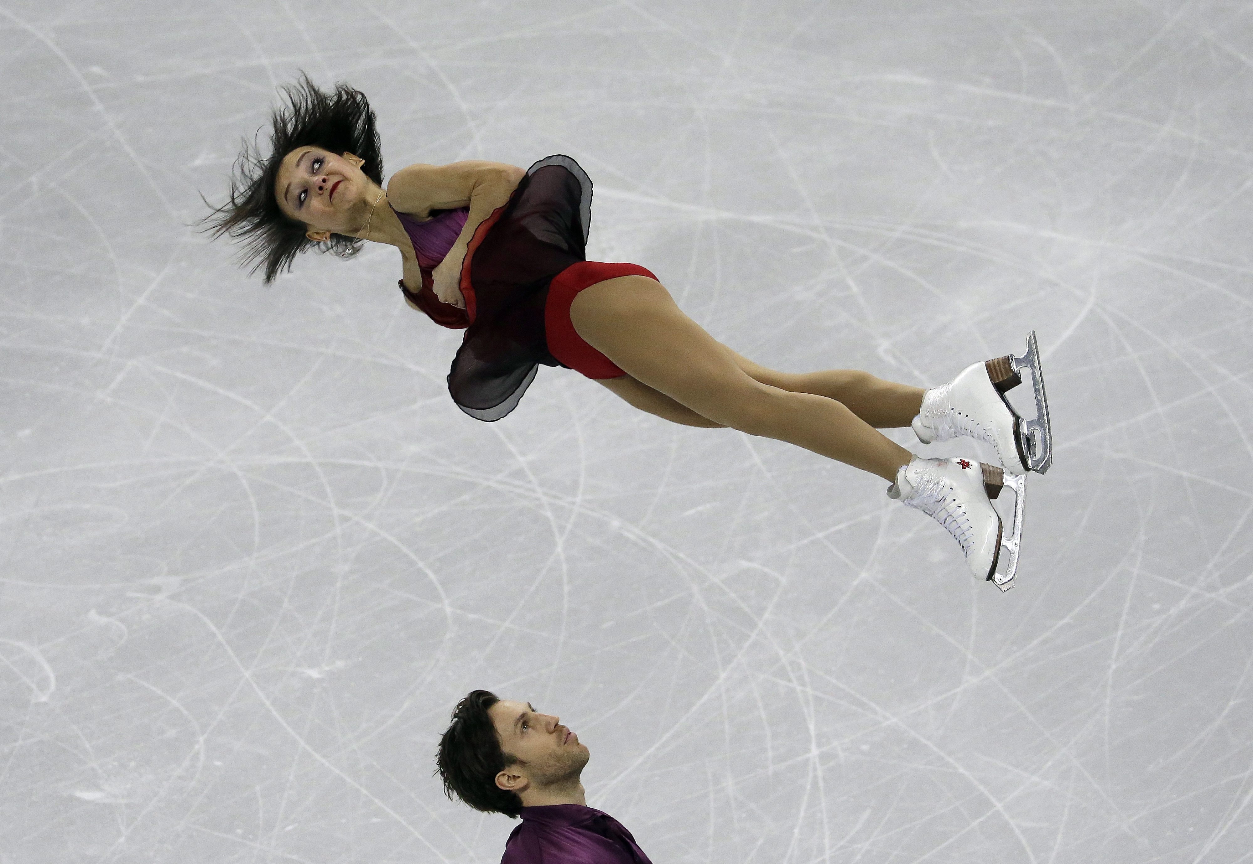 Bronze medalists Lubov Ilyushechkina and Dylan Moscovitch of Canada perform in the Pairs Free Skating at the ISU Four Continents Figure Skating Championships in Gangneung, South Korea, Saturday, Feb. 18, 2017. (AP Photo/Ahn Young-joon)