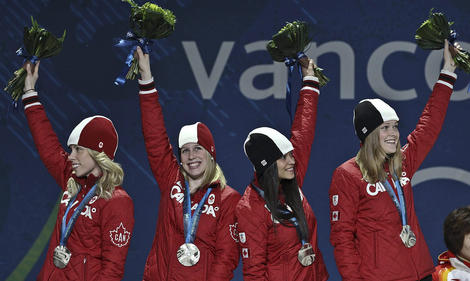 Short track medallists on the podium