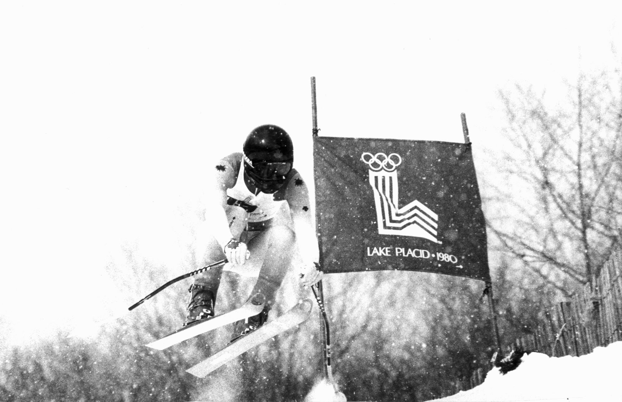 Canadian skier Steve Podborski is in the air while he speeds down the Whiteface Mountain race course on his way to win an Olympic bronze medal, clocking time 1.46.62, Feb. 14, 1980 (CP PHOTO/ AP)