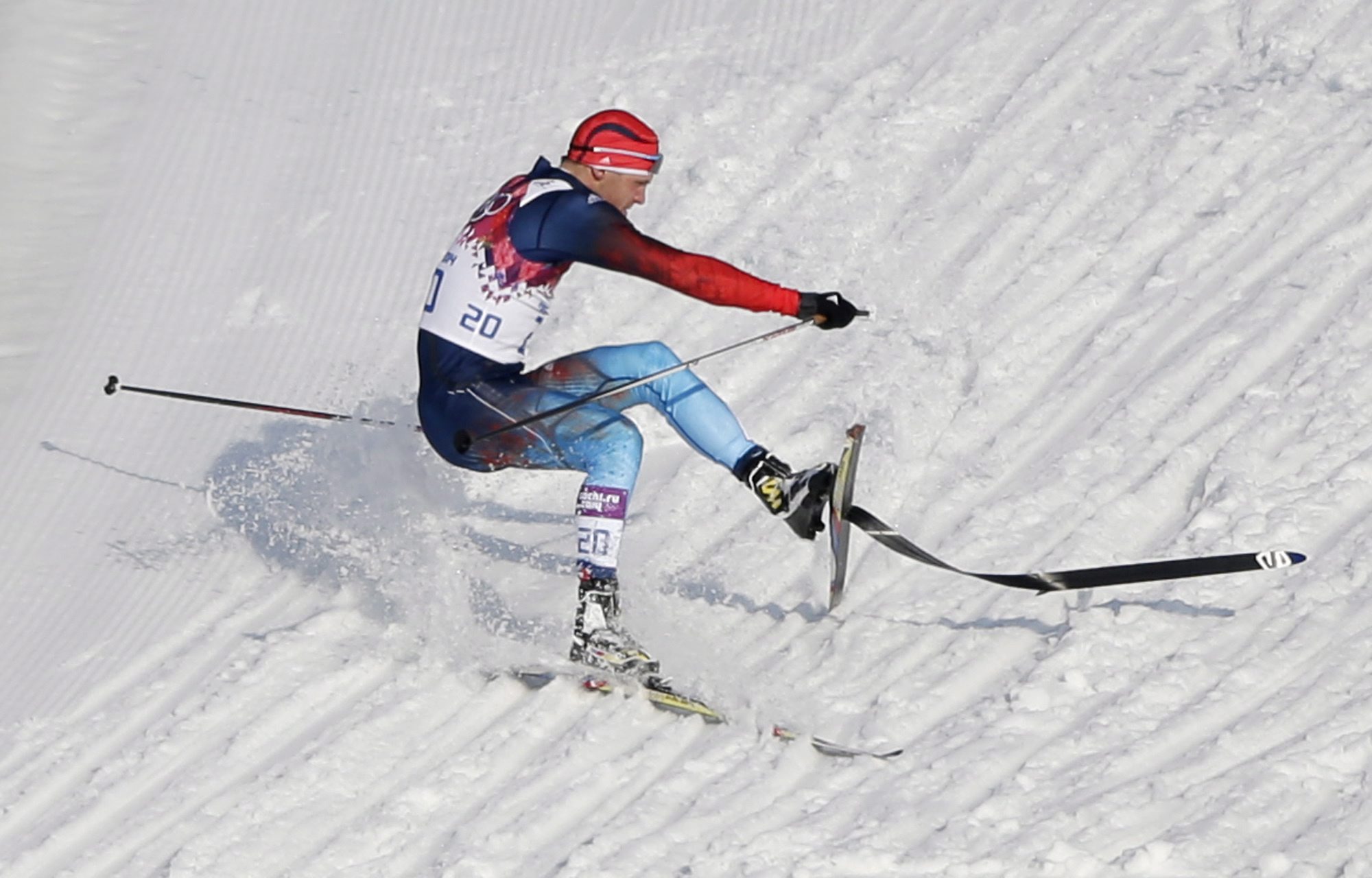Russia's Anton Gafarov falls with a broken ski during his men's semifinal of the cross-country sprint at the 2014 Winter Olympics, Tuesday, Feb. 11, 2014, in Krasnaya Polyana, Russia. (AP Photo/Matthias Schrader)